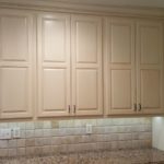 Raised Panel Cabinetry With Under Cabinet Lighing